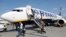 Passengers get off a Ryanair Boeing 737-8AS aircraft at the Boryspil International Airport near Kyiv in 2018.