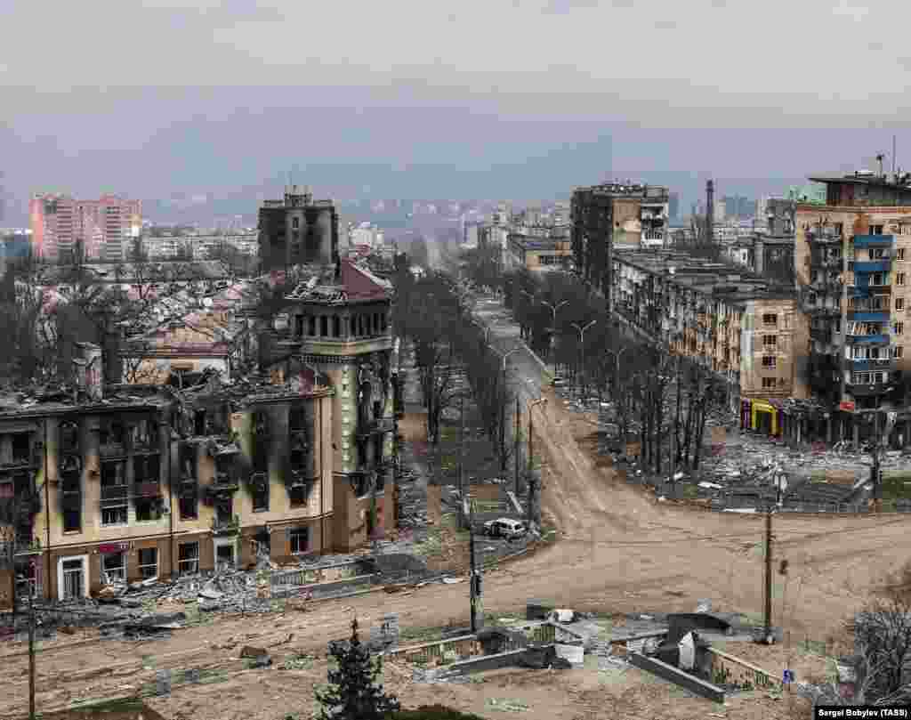 An aerial view of the crossroads and the same turreted building in April 2022.&nbsp;