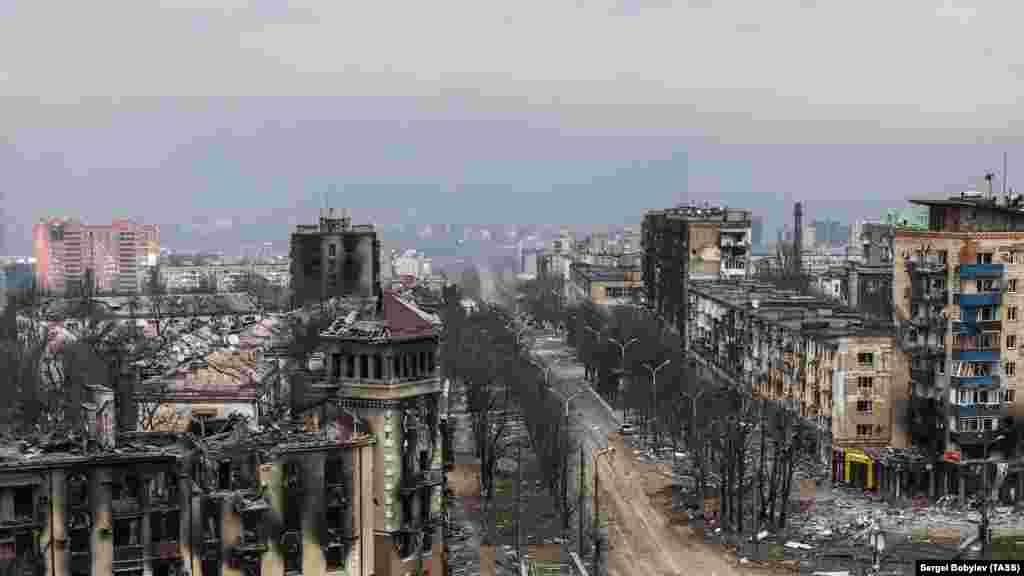 An aerial view of the crossroads and the same turreted building in April 2022.&nbsp;