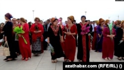 Turmen women wearing traditional dress