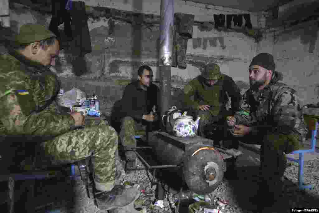 Ukrainian soldiers rest near the city of Izyum, southeast of Kharkiv, on May 2. Russian and Ukrainian forces have been battling in the area for weeks as Russia&#39;s military intensifies efforts to control eastern Ukraine. &nbsp;