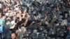 Armenia - Riot police confront opposition protesters outside the parliament building in Yerevan, May 4, 2022.