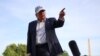 US President Donald Trump gestures as he speaks to reporters after arriving on the South Lawn of the White House on May 15.