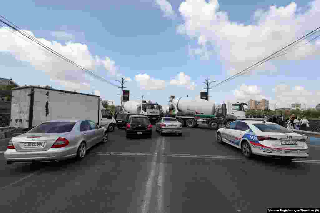Trucks block a bridge in central Yerevan on the morning of May 4. The truckers claimed to police that their vehicles had broken down.&nbsp;