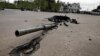 The turret of a destroyed Russian tank is seen embedded in the ground in Zalissya, in the Kyiv region, on May 3.