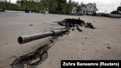 The turret of a destroyed Russian tank is seen embedded in the ground in Zalissya, in the Kyiv region, on May 3.