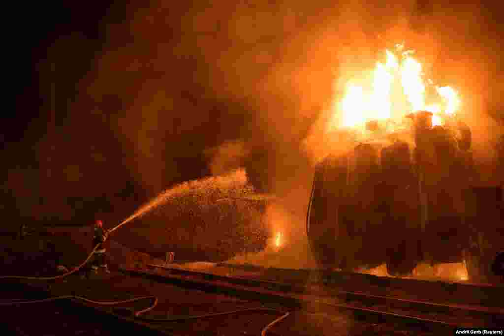 Firefighters battle a blaze at a power substation in Lviv hit by Russian missiles on May 3. Ukrainian officials said the Russian military also struck six railway stations in the central and western regions, inflicting heavy damage.