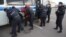 Russian Police detain alleged illegal migrants during a raid at a market in Moscow last month.