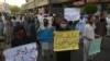 Supporters of the Pashtun Tahafuz Movement hold placards during a protest against the killing of a party leader Arif Wazir, in Karachi on May 5, 2020.