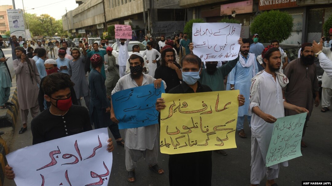 Supporters of the Pashtun Tahafuz Movement hold placards during a protest against the killing of a party leader Arif Wazir, in Karachi on May 5, 2020.