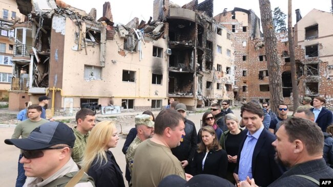 Canadian Prime Minister Justin Trudeau (second from right) visits the city of Irpin on May 8.