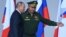 Рускиот претседател Владимир Путин и министерот за одбрана Сергеј Шојгу присуствуваат на церемонијата во Москва во август 2021 година.