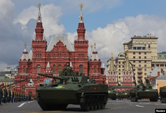 Russian BMD-4M infantry fighting vehicles and BTR-MDM armored personnel carriers drive on Red Square during the Victory Day parade.