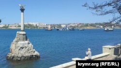 Crimea, Ukraine --Tugboats dragged a rocket hovercraft into the sea from the Sevastopol Bay, 08May2022