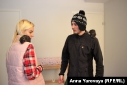 Viktoria Kuznetsova and Denys Fedotov in their apartment in Joensuu with one of their pet rats.