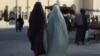 Burqa-clad women walk along a street in Kandahar, Afghanistan. (file photo)