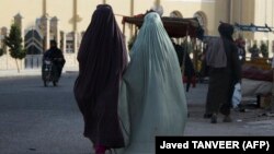 Burqa-clad women walk along a street in Kandahar, Afghanistan. (file photo)