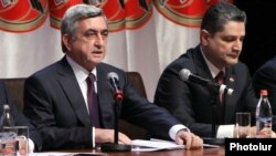 Armenia -- President Serzh Sarkisian (L) and Prime Minister Tigran Sarkisian at a congress of the ruling Republican Party, Yerevan, 10Mar2012.