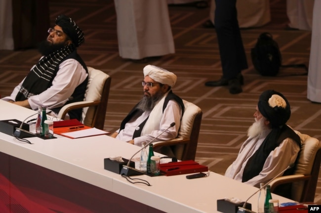 Members of the Taliban delegation attend the opening session of the peace talks in the Qatari capital, Doha, on September 12.