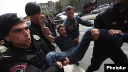 Armenia - Riot police arrest an opposition protester in Yerevan, May 5, 2022.