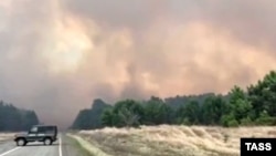 A view of the wildfires in the Minusinsky district of Krasnoyarsk Krai in Siberia.