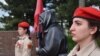 Mariupol, a sculpture of "grandma with red flag"