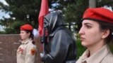 Mariupol, a sculpture of "grandma with red flag"