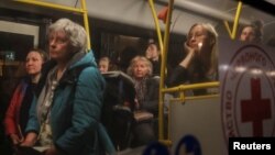 Ukrainian evacuees from Mariupol take a bus to a registration and humanitarian aid center for internally displaced persons on May 8. Russia is accused of forcibly deporting up to 1.6 million Ukrainians to Russia since February.