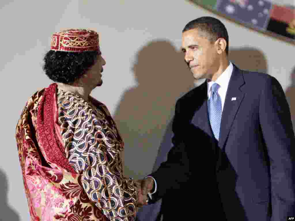 U.S. President Barack Obama shakes hands with Qaddafi during the G8 summit in L'Aquila, Italy, on July 9, 2009.