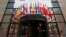 A woman walks past the entrance of the European Council headquarters in Brussels. (file photo)
