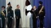 Russian President Vladimir Putin (2nd right) and National Guard chief Viktor Zolotov (3rd left) take part in a ceremony marking National Guard Day in Moscow on March 27.