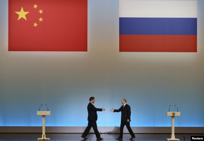 President Vladimir Putin (right) and his Chinese counterpart, Xi Jinping, in Moscow in March 2013 during Xi's first foreign trip as leader.