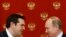 Greek Prime Minister Alexis Tsipras (L) speaks with Russian President Vladimir Putin during a signing ceremony at the Kremlin in Moscow, April 8, 2015.