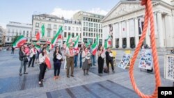 Members of the Belgian-Iranian community gather to protest against the mass execution of political prisoners in Iran in Brussels.