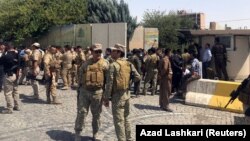 Эрбилде содырлар басып алған үкімет ғимаратын қоршап тұрған қауіпсіздік қызметкерлері. Ирак, 23 шілде 2018 жыл.