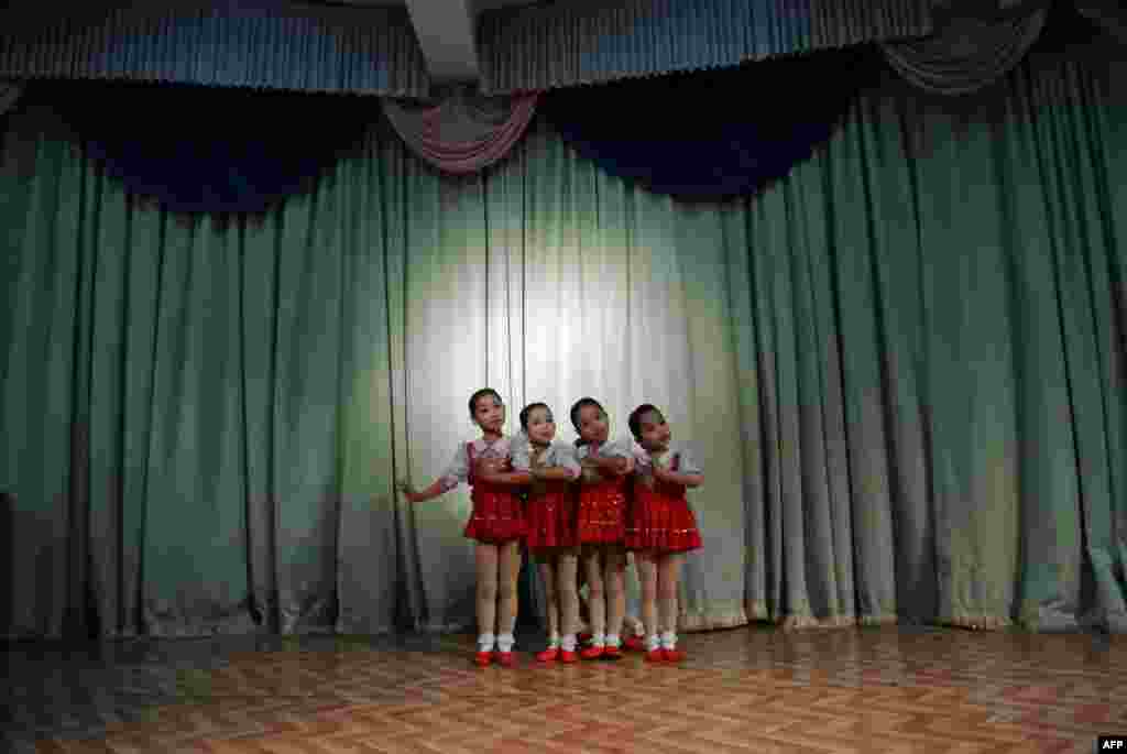 North Korean girls dance during a performance at a nursery school in the North Korean border town of Siniuju, across from China's northeastern city of Dandong. (AFP/Wang Zhao)