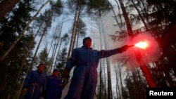 Roscosmos cosmonauts Sergei Prokopyev and Oleg Artemyev (in back) taking part in a survival training exercise in Star City outside Moscow with NASA astronaut Andrew Feustel (front) in 2017.