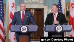 Georgian Prime Minister Mamuka Bakhtadze (left) and U.S. Secretary of State Mike Pompeo speak to the media on June 11. 
