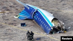 A drone view shows the crash site of a passenger plane near Aktau, Kazakhstan, on December 25. 