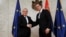 European Commission President Jean-Claude Juncker (left) shakes hands with Serbian President Aleksandar Vucic in Belgrade on February 26.