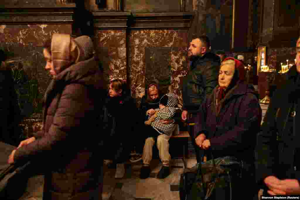 People attend early morning Ukrainian Orthodox Church services at St. Volodymyr&#39;s Cathedral in Kyiv.&nbsp;