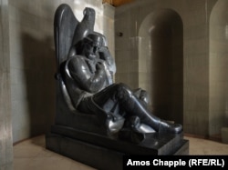 A granite statue to Njegos inside the mausoleum. His remains are in a crypt below this main room of the mausoleum.