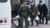 Mobilized men board a bus outside a temporary mobilization station set up at Moscow's Roman Viktyuk Theater at the end of September.