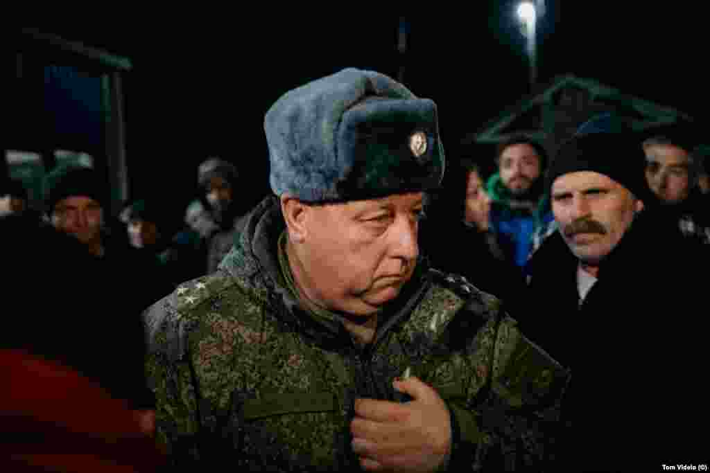 Igor Sazonov, an officer in the Russian peacekeeping force, leaves the Tegh checkpoint on December 26, after speaking with ethnic Armenian protesters demanding the reopening of the Lachin Corridor.