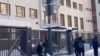 A video grab from Russian pro-government Telegram channels uploaded on December 20 shows masked men throwing sledgehammers over the fence of Finland's diplomatic mission in Moscow, but they do not reach the building itself.