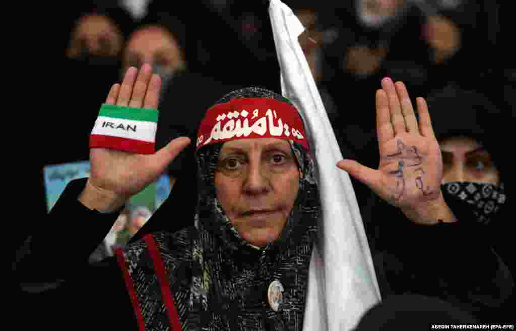 A woman attends an event marking the third death anniversary of the former commander of Iran&#39;s Quds Force, Qasem Soleimani, at the Mosallah Mosque in Tehran on January 3. He was killed by the United States in a drone attack in Iraq in 2020.