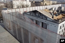 Footage from December 2, 2022, shows fencing surrounding the Mariupol theater.