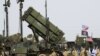 ISRAEL – US army officers stands in front a US Patriot missile defence system during a joint Israeli-US military exercise "Juniper Cobra" at the Hatzor Airforce Base, March 8, 2018