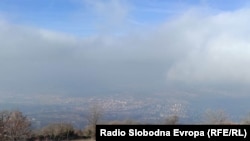 view of Skopje from the top of Vodno and the cross of Vodno in the fog