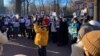 Dozens of men and women rallied in Bishkek's Panfilov Park on December 20, holding portraits of their loved ones and demanding their transfer to house arrest.